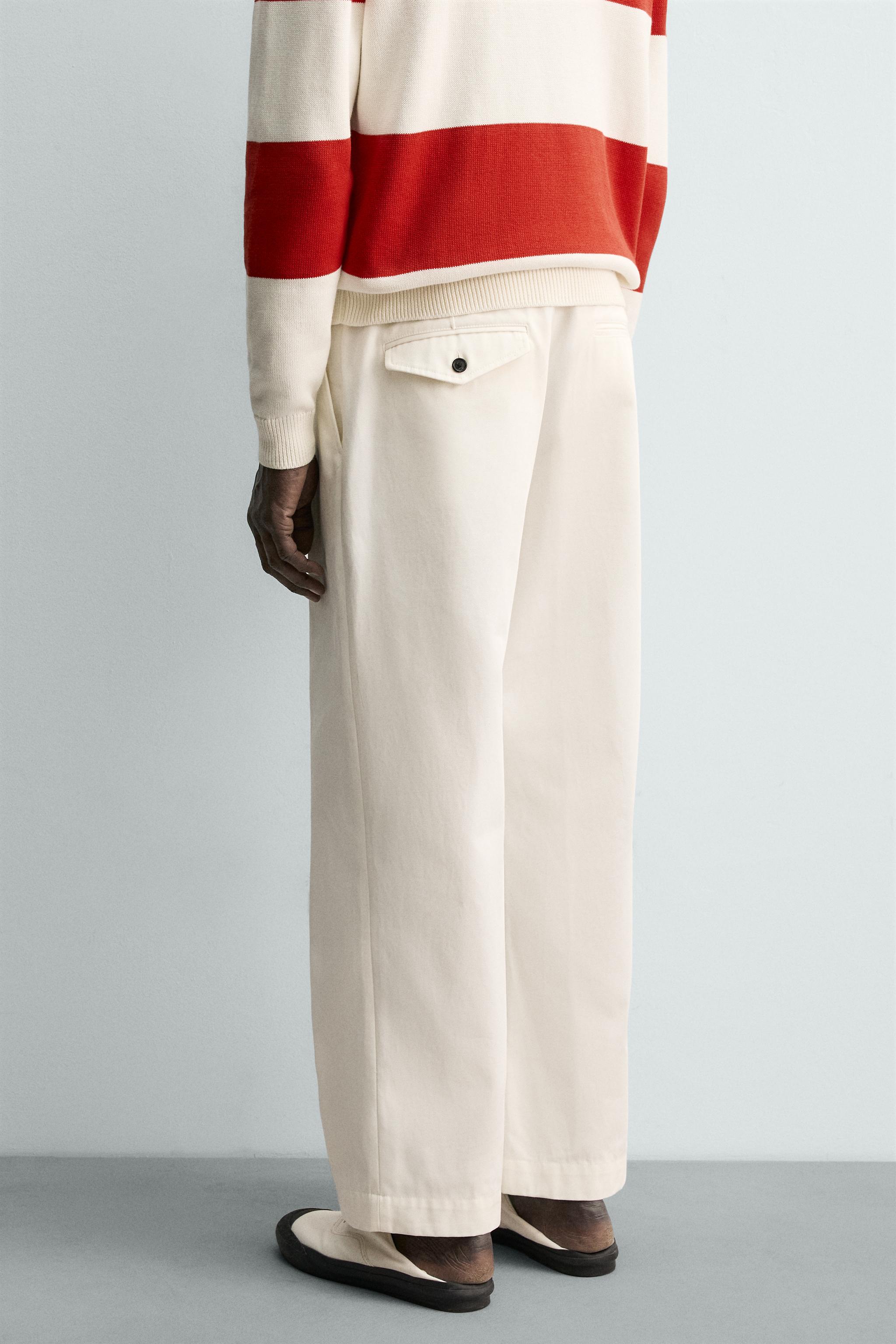 PANTALON CHINO À PLIS AARON LEVINE X ZARA